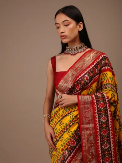 Chrome Yellow Saree In Silk With Multi Colored Patola And Foil Print And Contrasting Maroon Border